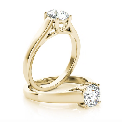 This Lucida solitaire engagement ring emphasize the center diamond. Yellow Gold