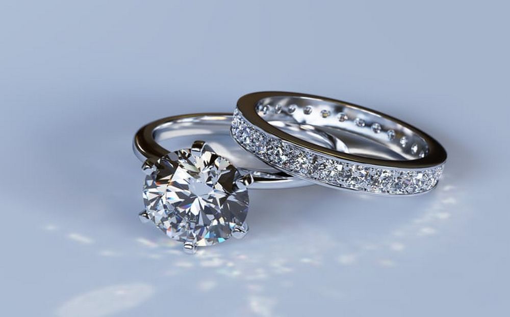 Engagement ring with diamond band and meaningful engraving