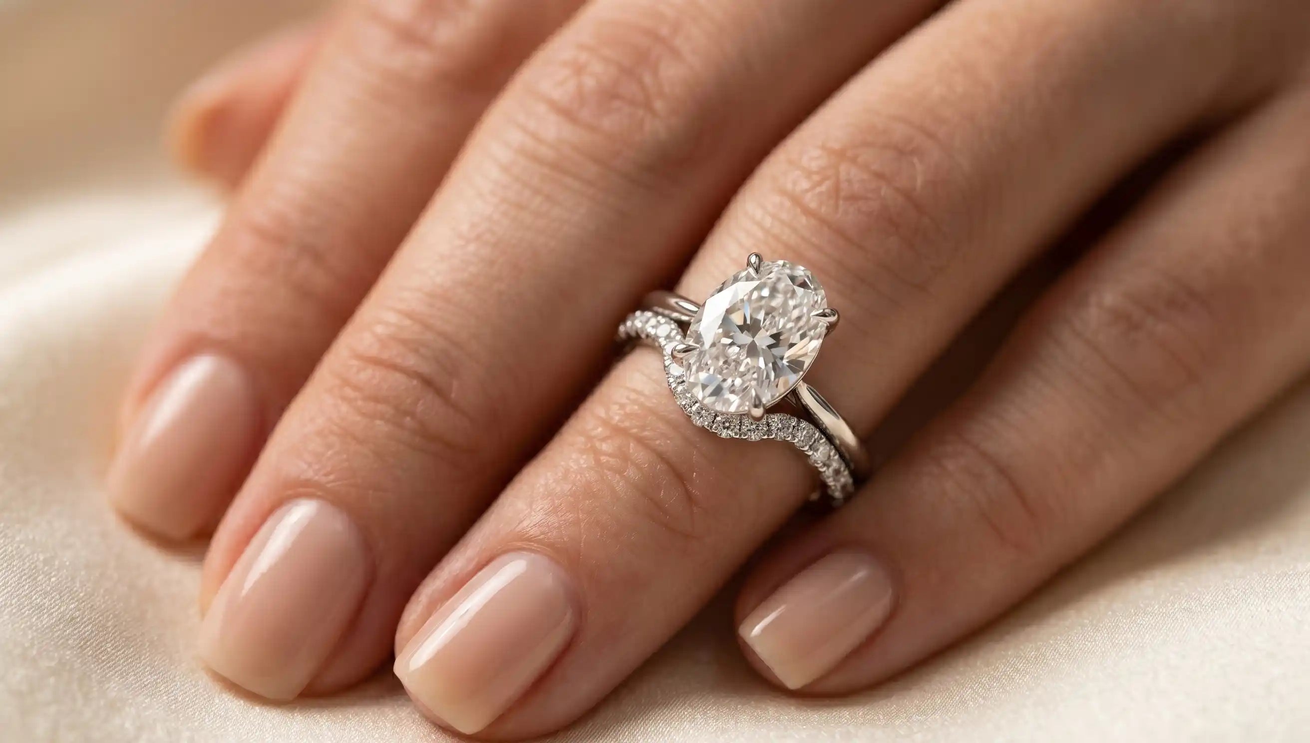 oval engagement ring with wedding band elegant pairing on hand