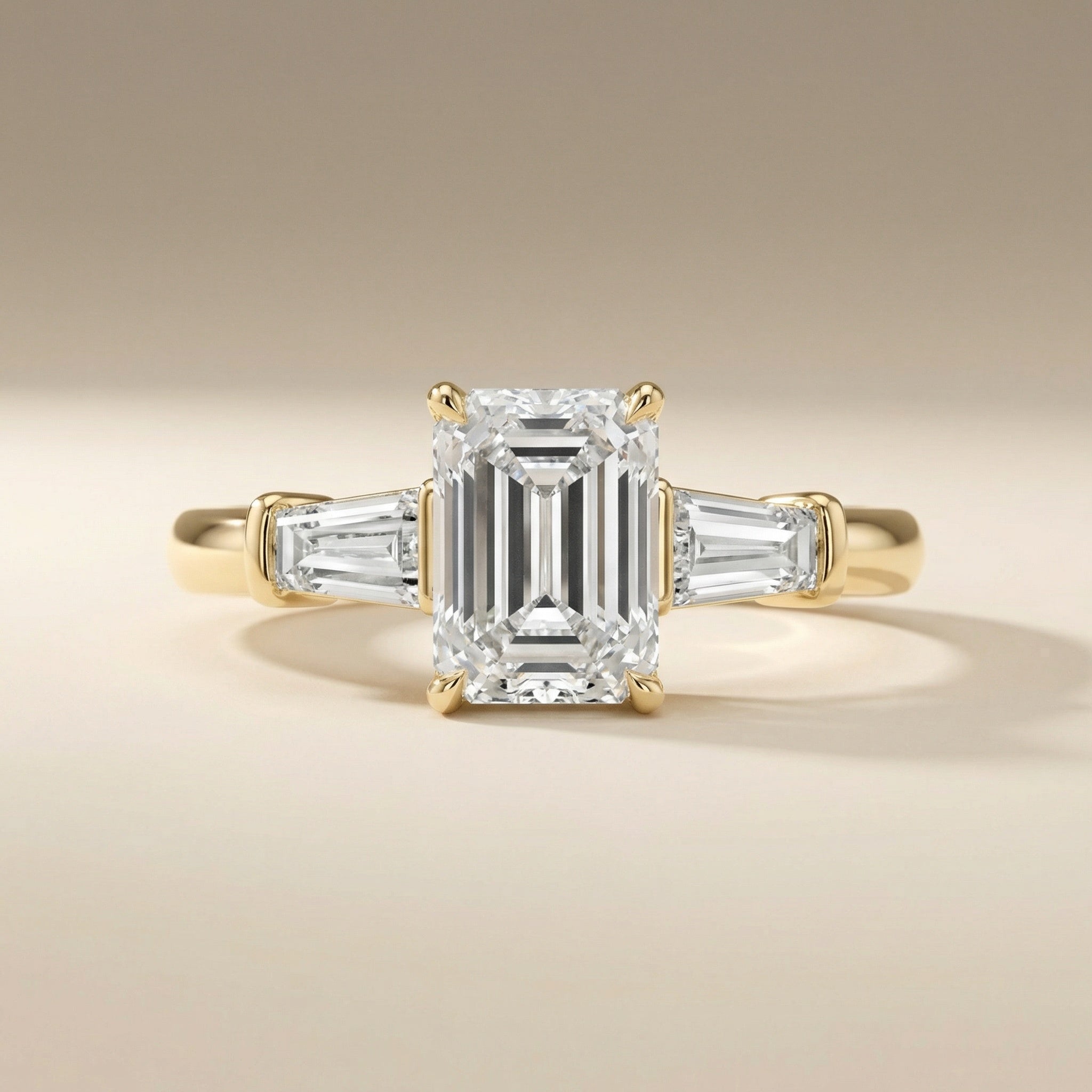 LUX-85336 Emerld Cut Three Stone Engagement Ring With Tapered Baguettes Luxury Diamonds