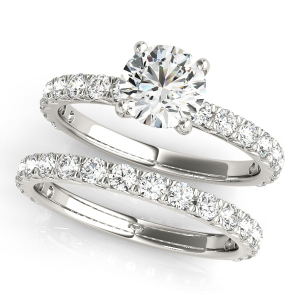 This beautiful pave diamond engagement ring is created to maximize the light that hits the diamonds from all around. 14k