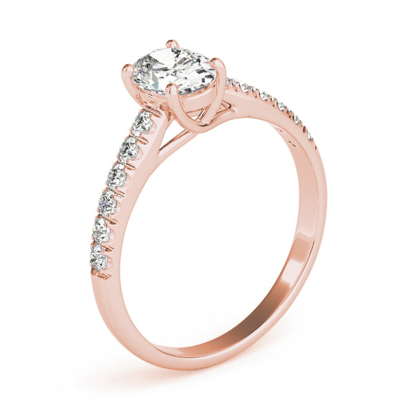 This beautiful oval diamond engagement ring showcases round diamonds in pink gold