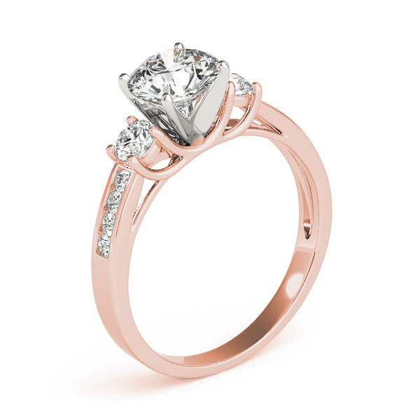 This beautiful three stone diamond engagement ring showcases eight round diamonds that are set in channel design to accent your center diamond.