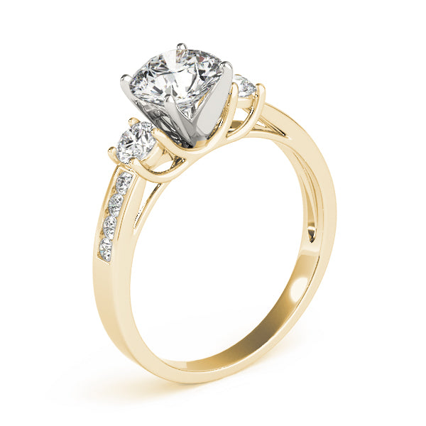 This beautiful three stone diamond engagement ring showcases eight round diamonds that are set in channel design to accent your center diamond.