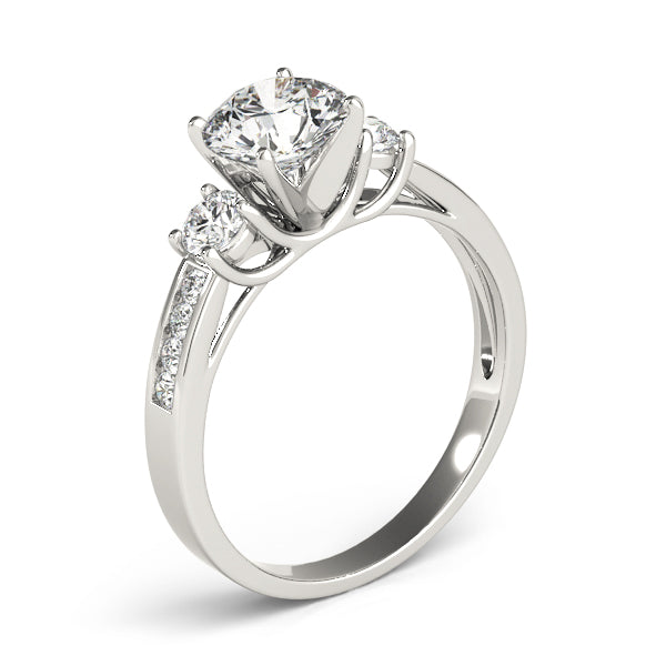 This beautiful three stone diamond engagement ring showcases eight round diamonds that are set in channel design to accent your center diamond.