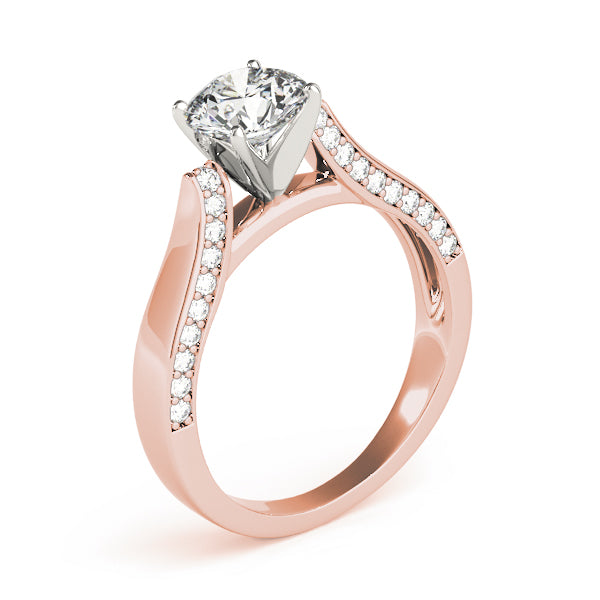This unique design engagement ring features pave set diamonds that are set on the side of the shank to compliment the center diamond of your choice.