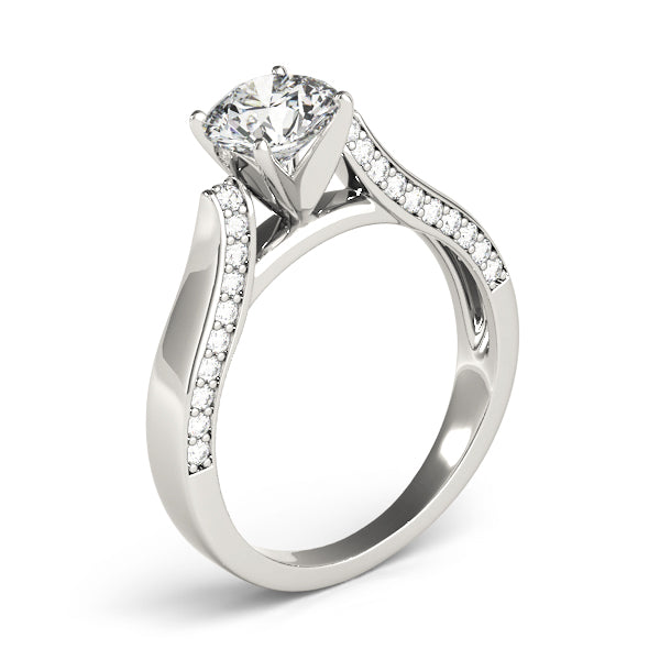 This unique design engagement ring features pave set diamonds that are set on the side of the shank to compliment the center diamond of your choice.