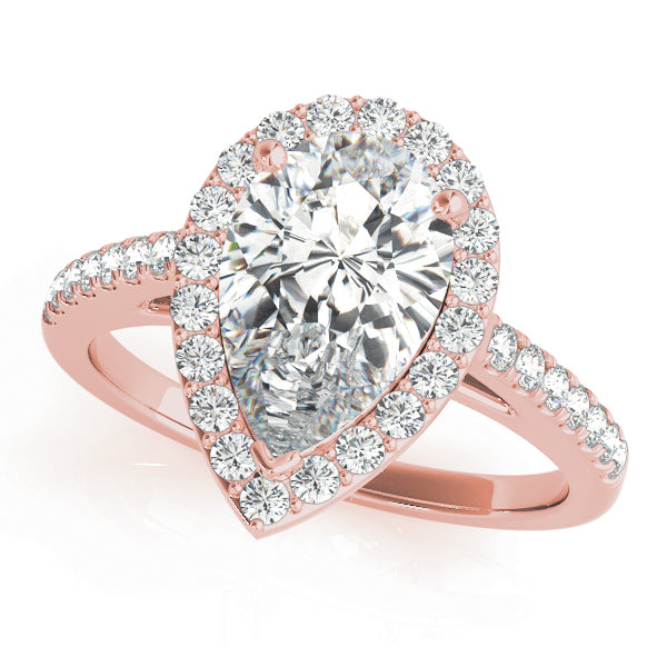 This elegant white gold pear shape halo engagement ring featuring pave set diamonds and your choice of center stone.