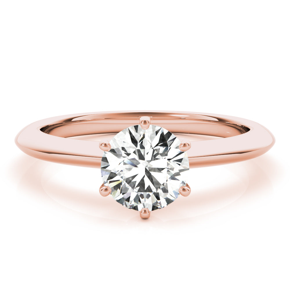 Simply elegant. This knife edge solitaire engagement ring is perfect to showcase the center diamond of your choice.