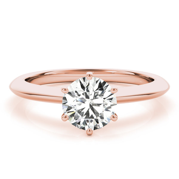 Simply elegant. This knife edge solitaire engagement ring is perfect to showcase the center diamond of your choice.