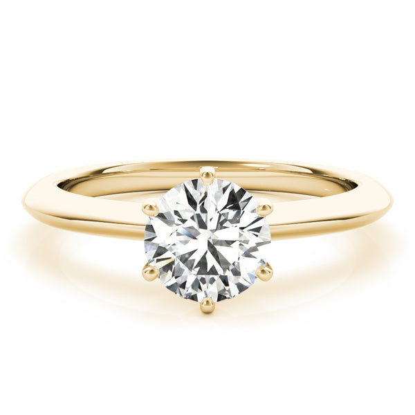 Simply elegant. This knife edge solitaire engagement ring is perfect to showcase the center diamond of your choice.