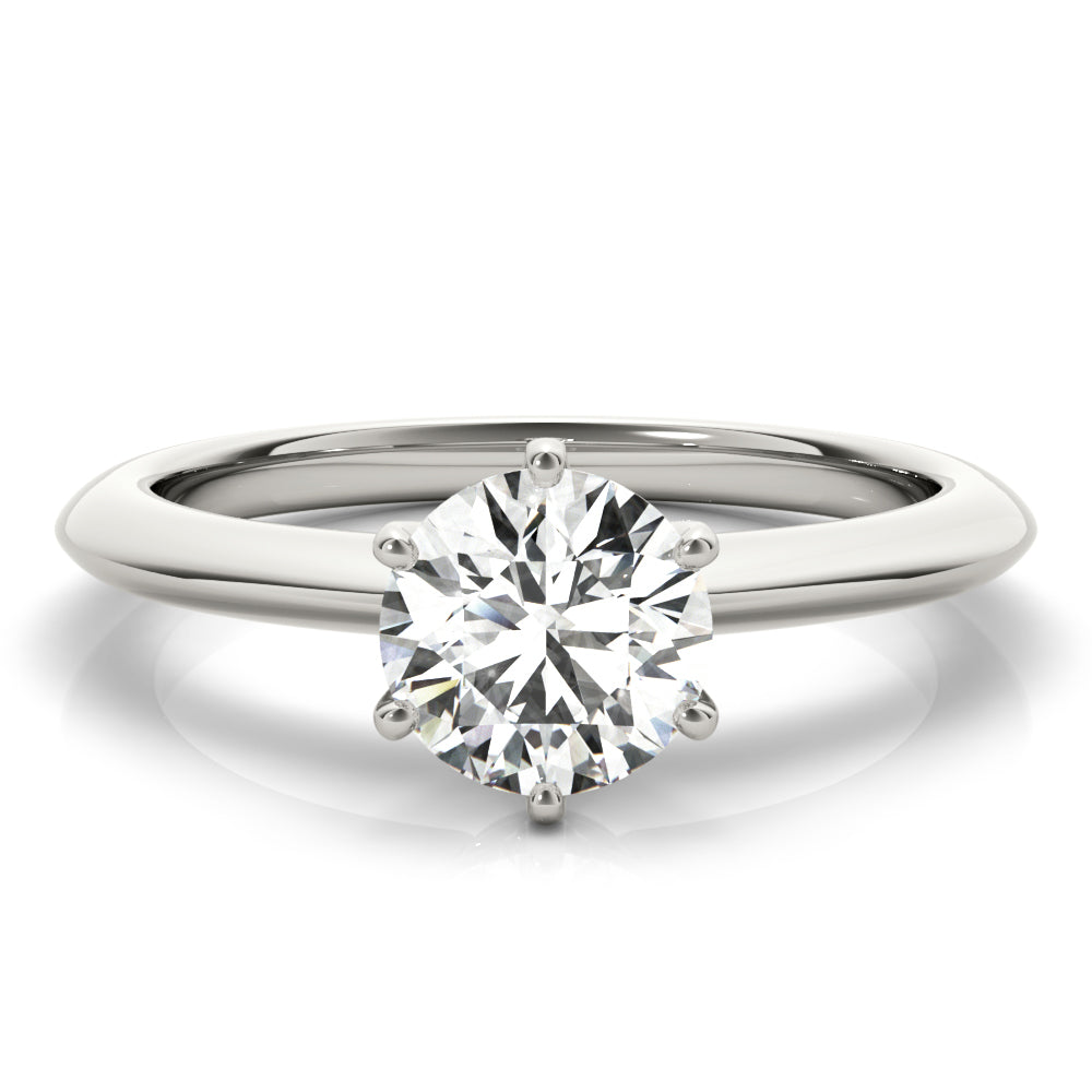 Simply elegant. This knife edge solitaire engagement ring is perfect to showcase the center diamond of your choice.