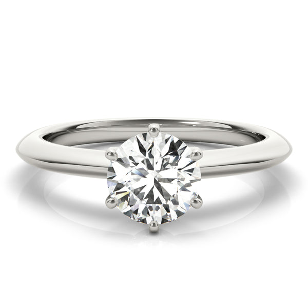 Simply elegant. This knife edge solitaire engagement ring is perfect to showcase the center diamond of your choice.