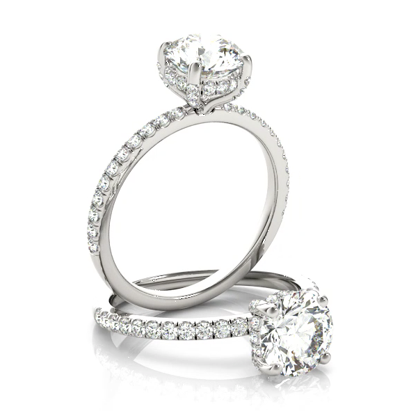 This gorgeous engagement ring features a sparkling hidden halo of diamonds that wraps around the center diamond. White Gold
