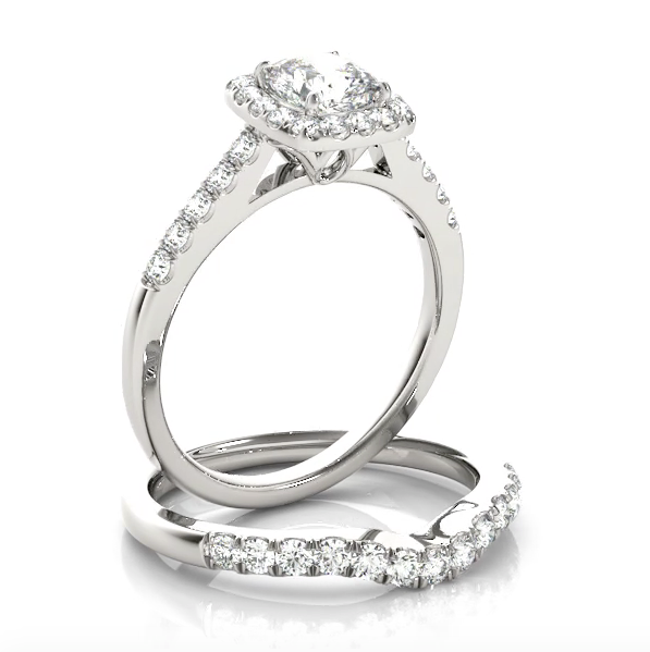 This modern square halo engagement ring features a single row of micro pave set round brilliant cut diamonds and your choice of center stone. Platinum
