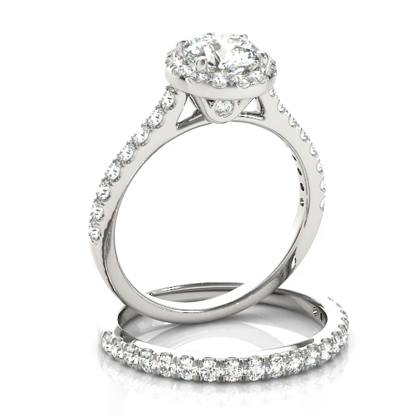 This classic halo engagement ring features a micro pave set diamonds with a center stone of your choice.