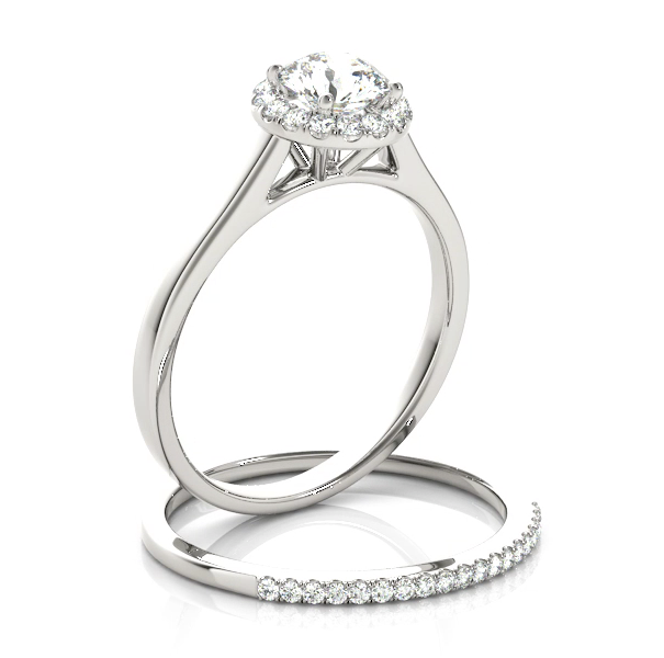 This classic halo engagement ring features a micro pave set diamonds around the center gem. 18k
