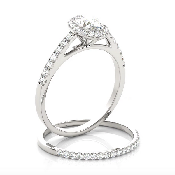 This beautiful oval shaped halo engagement ring features a single row of micro pave set round brilliant cut diamonds framing the oval diamond of your choice. 18kt