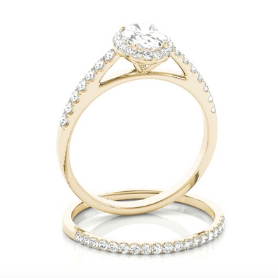 This beautiful white gold oval shaped halo engagement ring features a single row of micro pave set round brilliant cut diamonds framing the oval diamond of your choice. Yellow Gold