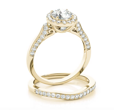Beautiful in every way, this diamond engagement ring features round diamonds set in a halo design. Yellow Gold