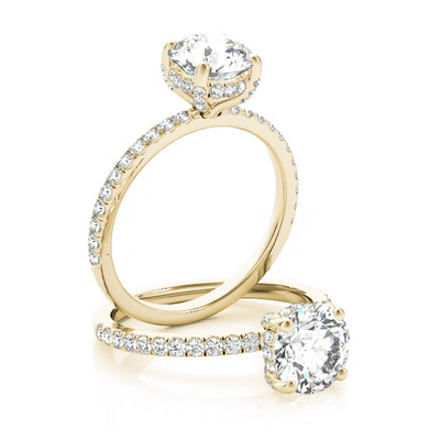 This gorgeous engagement ring features a sparkling hidden halo of diamonds that wraps around the center diamond.. Yellow Gold