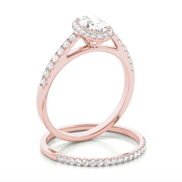 This beautiful white gold oval shaped halo engagement ring features a single row of micro pave set round brilliant cut diamonds framing the oval diamond of your choice. Pink Gold