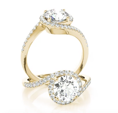 This modern engagement ring bypass features pave set diamonds with the center stone of your choice. Gold