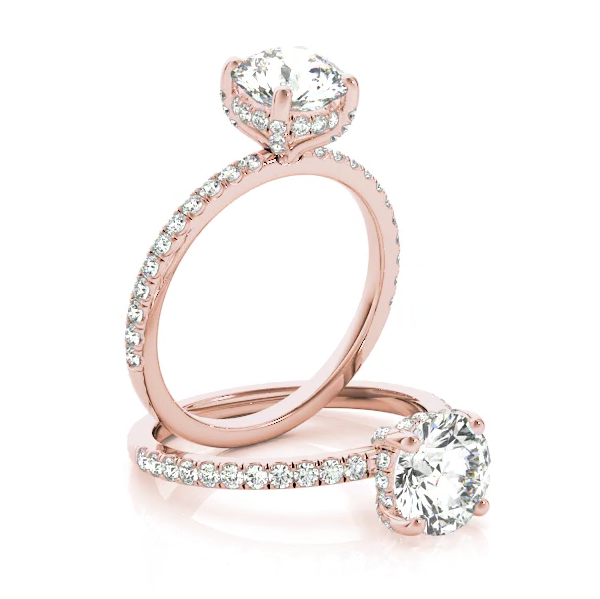 This gorgeous engagement ring features a sparkling hidden halo of diamonds that wraps around the center diamond. Pink Gold