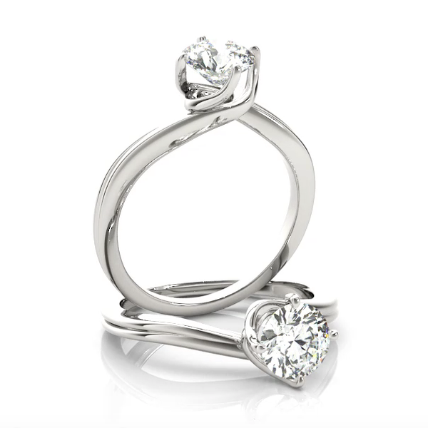 This elegant diamond engagement ring solitaire design has a twist.