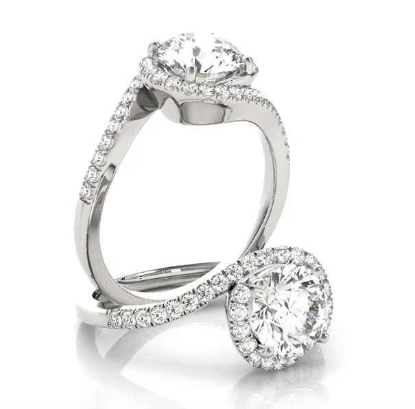 This modern engagement ring bypass features pave set diamonds with the center stone of your choice.